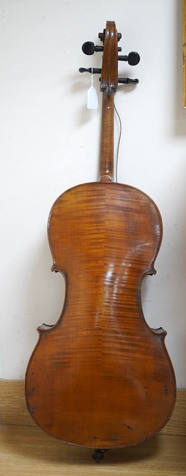 A late 19th century small cello, unsigned and without label inside body, stamped inventory number 769, length of back 62cm. Condition - poor to fair
